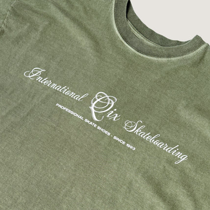 CAMISETA QIX BOX INTERNACIONAL SKATEBOARDS OLIVA ESTONADO
