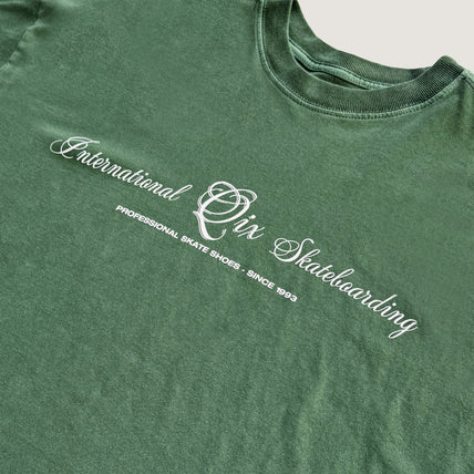 CAMISETA QIX BOX INTERNACIONAL SKATEBOARDS VERDE ESTONADO